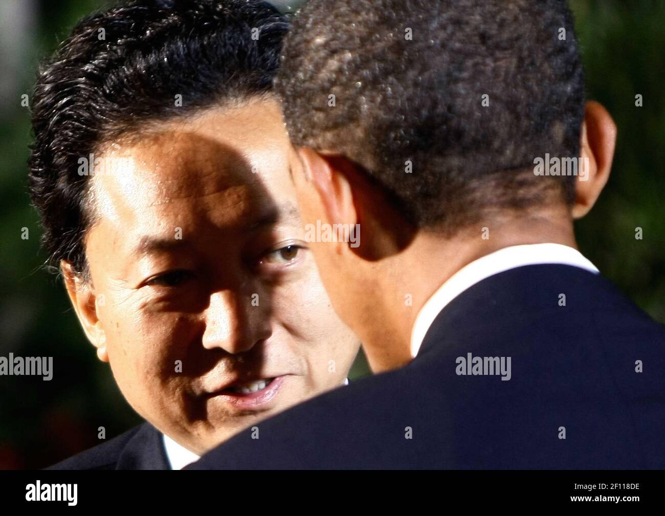 24 September 2009 - Pittsburgh, Pennsylvania - U.S. President Barack Obama (R) escorts Japanese Prime Minister Yukio Hatoyama while welcoming him to the opening dinner for G-20 leaders at the Phipps Conservatory on September 24, 2009 in Pittsburgh, Pennsylvania. Heads of state from the world's leading economic powers arrived today for the two-day G-20 summit held at the David L. Lawrence Convention Center aimed at promoting economic growth. Photo Credit: Win McNamee/Pool/Sipa Press/0909251418 Stock Photo