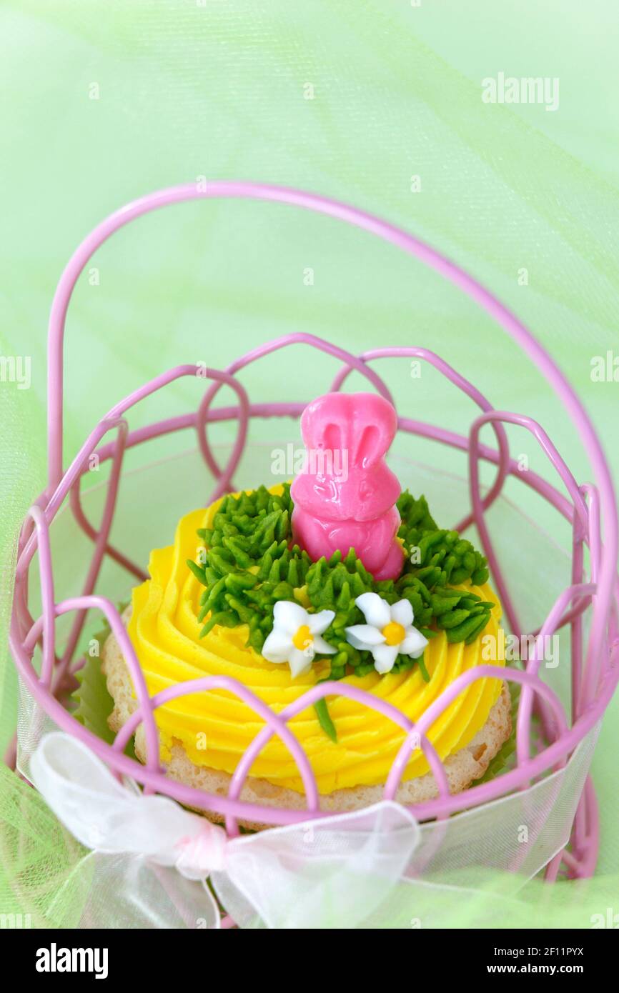 Easter cupcake in a basket Stock Photo