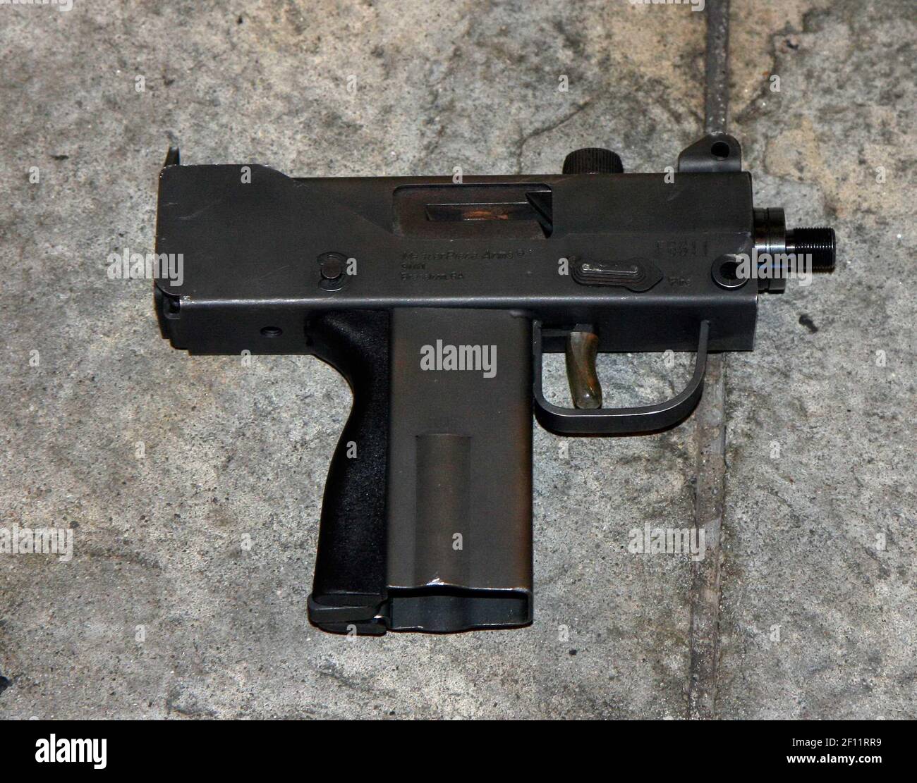 10 December 2009 - Mac-10 machine pistol used by suspect seen here in a handout from the NYPD. Two males illegally selling CD's in the vicinity of Times Square were approached by two NYPD officers. One man fled and the other fired a Mac-10 machine pistol at officers who returned fire killing the suspect. Photo Credit: Sipa Press/0912111821 Stock Photo