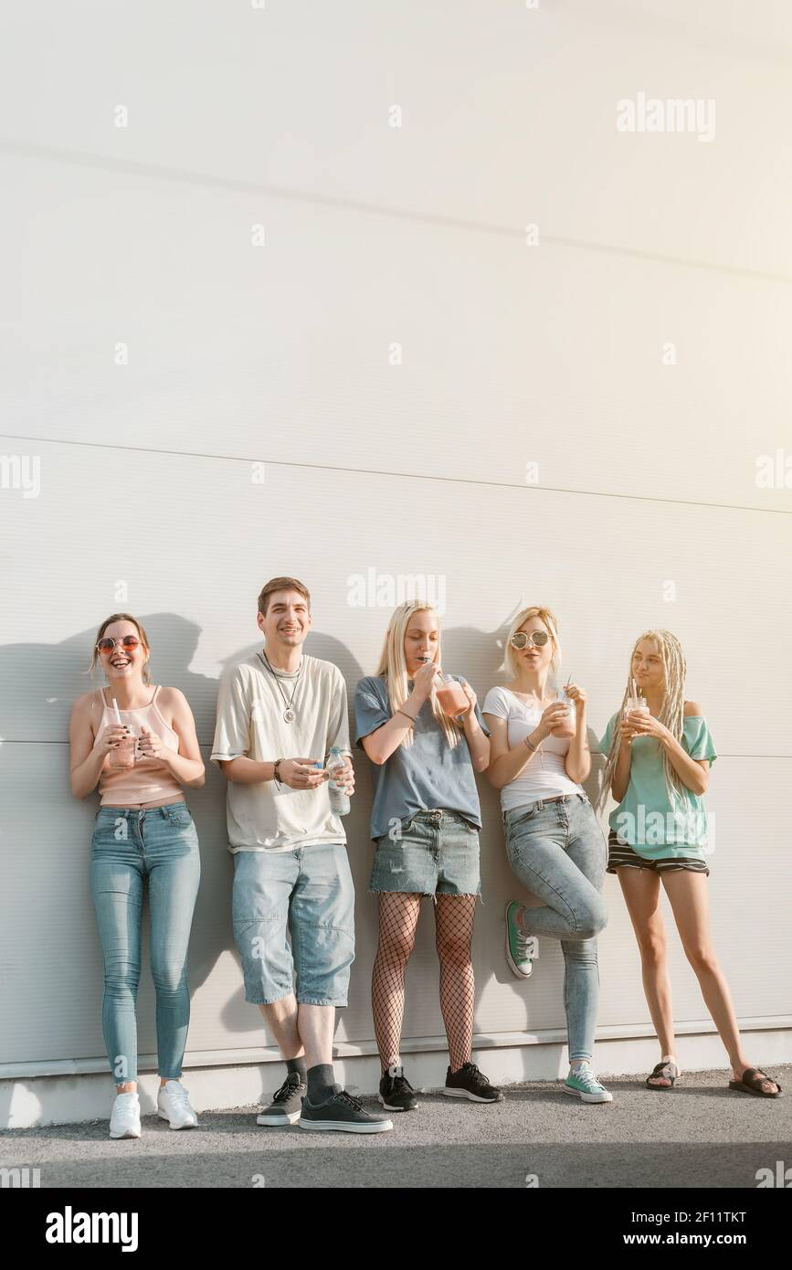 Group of young people, friends hanging together and laughing Stock Photo