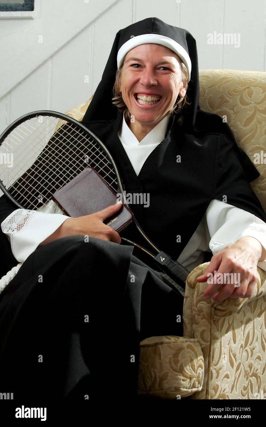 Sister Andrea Jaeger poses with her brown leather Bible and a tennis