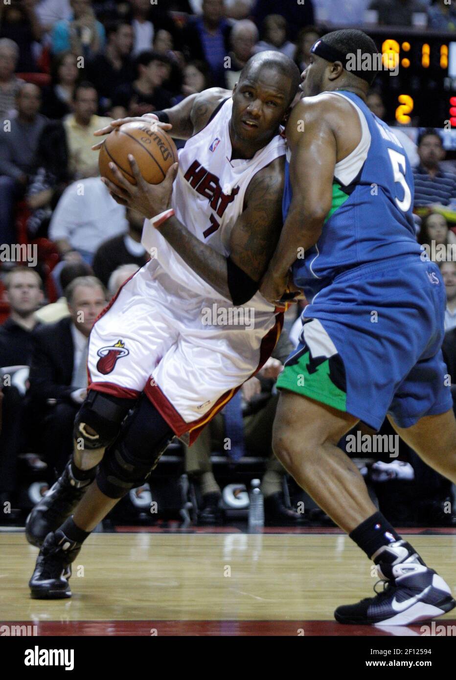 Miami Heat's Jermaine O'Neal drives to the basket against the
