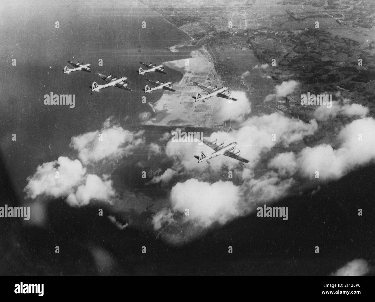 Formation of B-29s over unidentified Japanese installation, 1945 Stock Photo