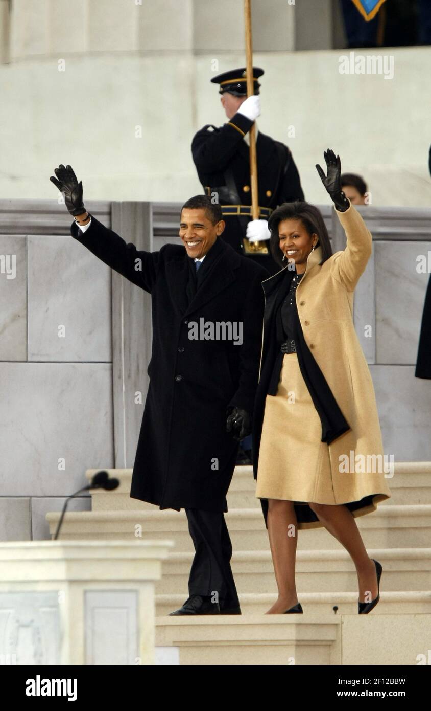 President-elect Barack Obama and his wife, Michelle, wave to the crowd ...