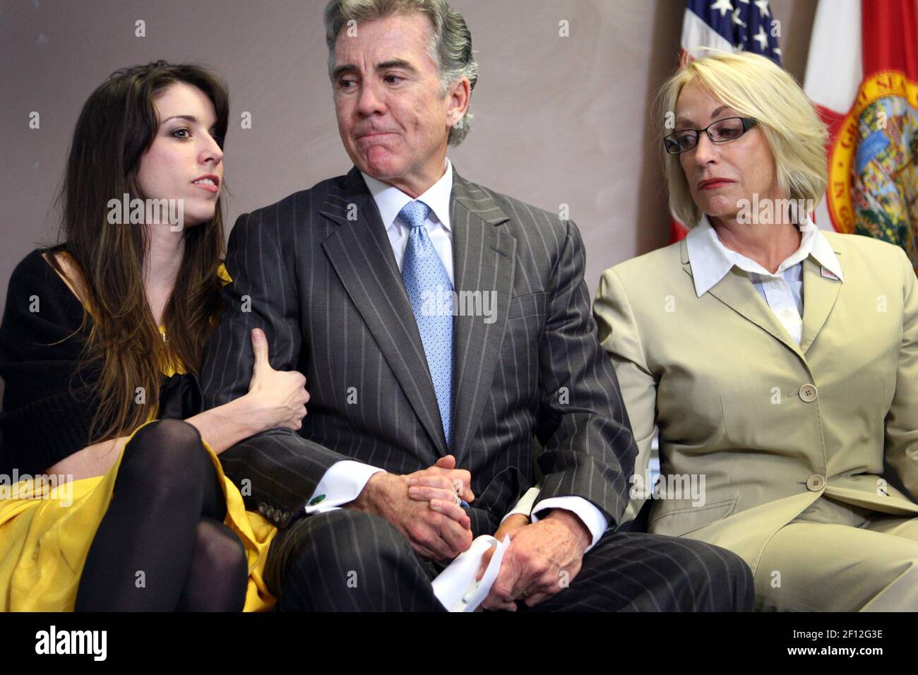 Meghan Walsh, 26, (left) John Walsh (center) and Reve Walsh attend a