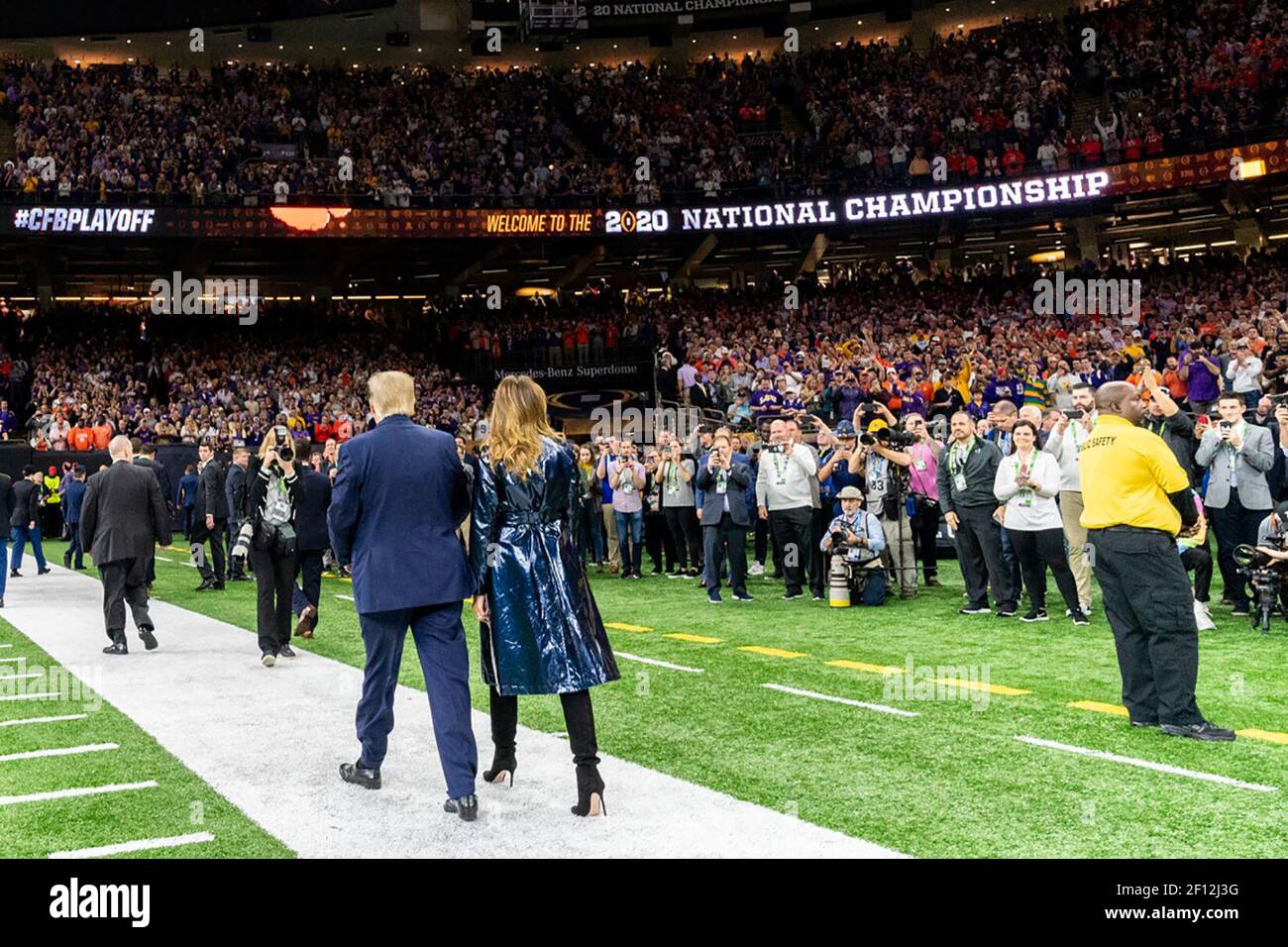 President Donald Trump and First Lady Melania Trump depart the field during the College Football Playoff National Championship between Clemson University and Louisiana State University Monday Jan. 13 2020 at the Mercedes-Benz Superdome in New Orleans. Stock Photo