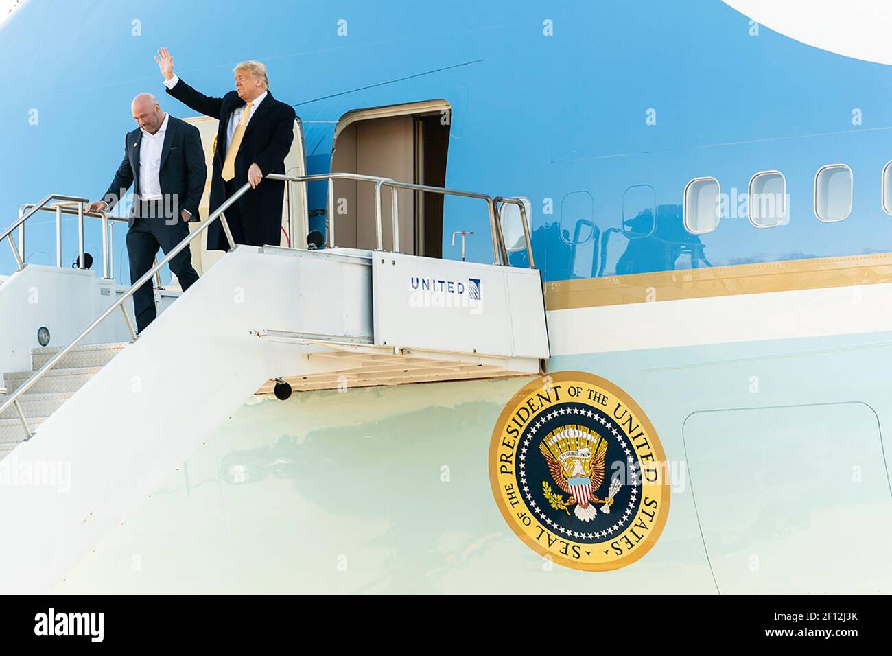President Donald Trump is joined by Dana White the president of the Ultimate Fighting Championship (UFC) as they disembark Air Force One Thursday Feb. 20 2020 at Peterson Air Force Base in Colorado Spring Colo. Stock Photo