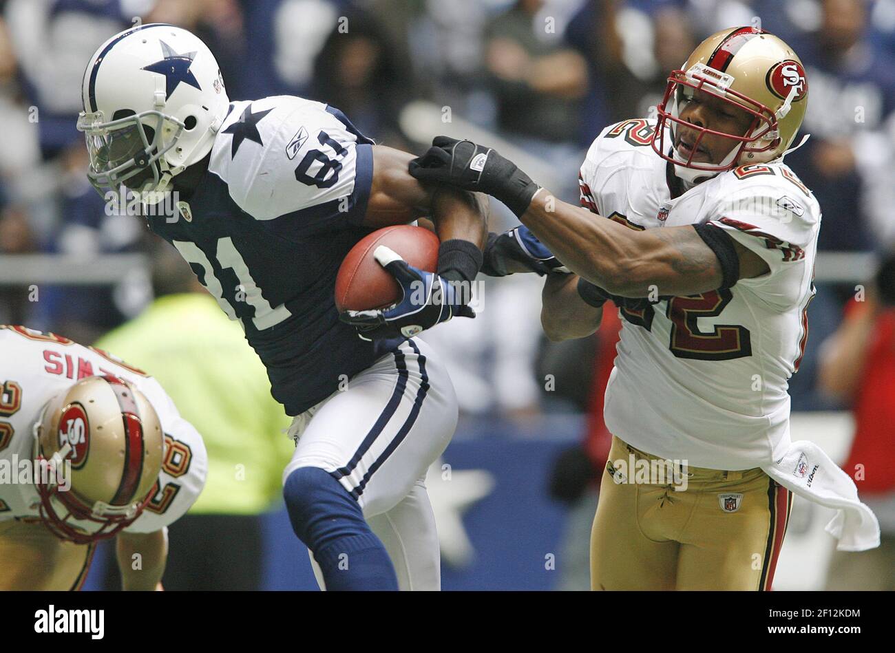 Dallas Cowboys' Terrell Owens beats San Francisco 49ers' Keith Lewis, left,  and Nate Clements to the end zone in second quarter action. The Cowboys  defeated the 49ers 35-22, at Texas Stadium in