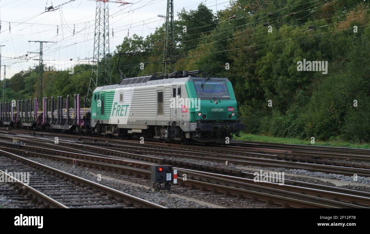 A SNCF Alstom Prima El3U electric powered locomotive with goods wagons ...