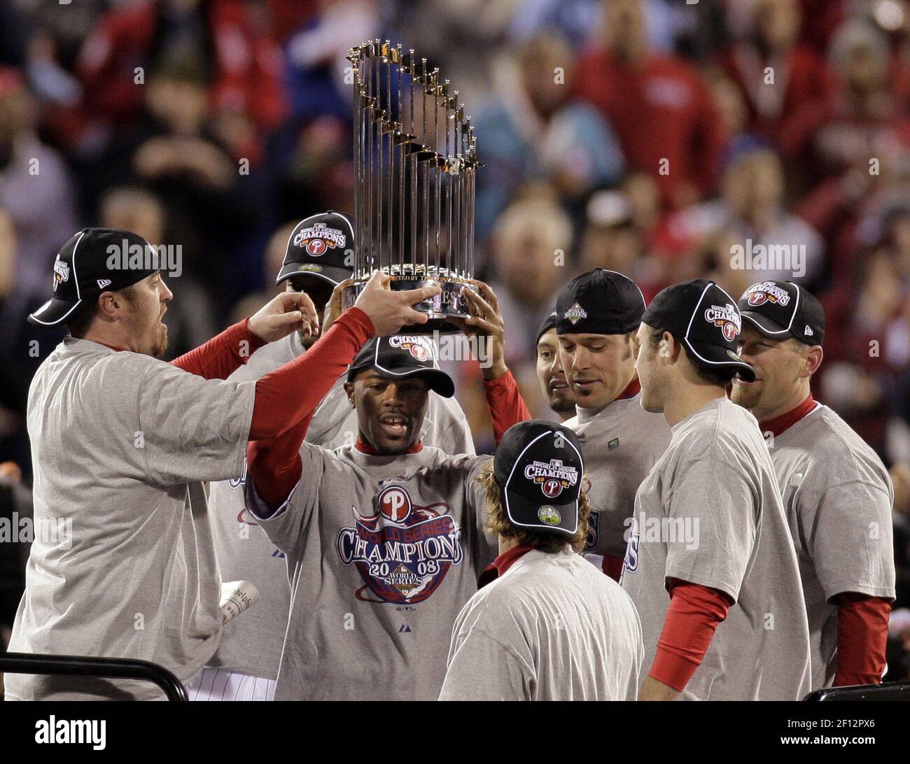 The Philadelphia Phillies' Jimmy Rollins holds up the World Series