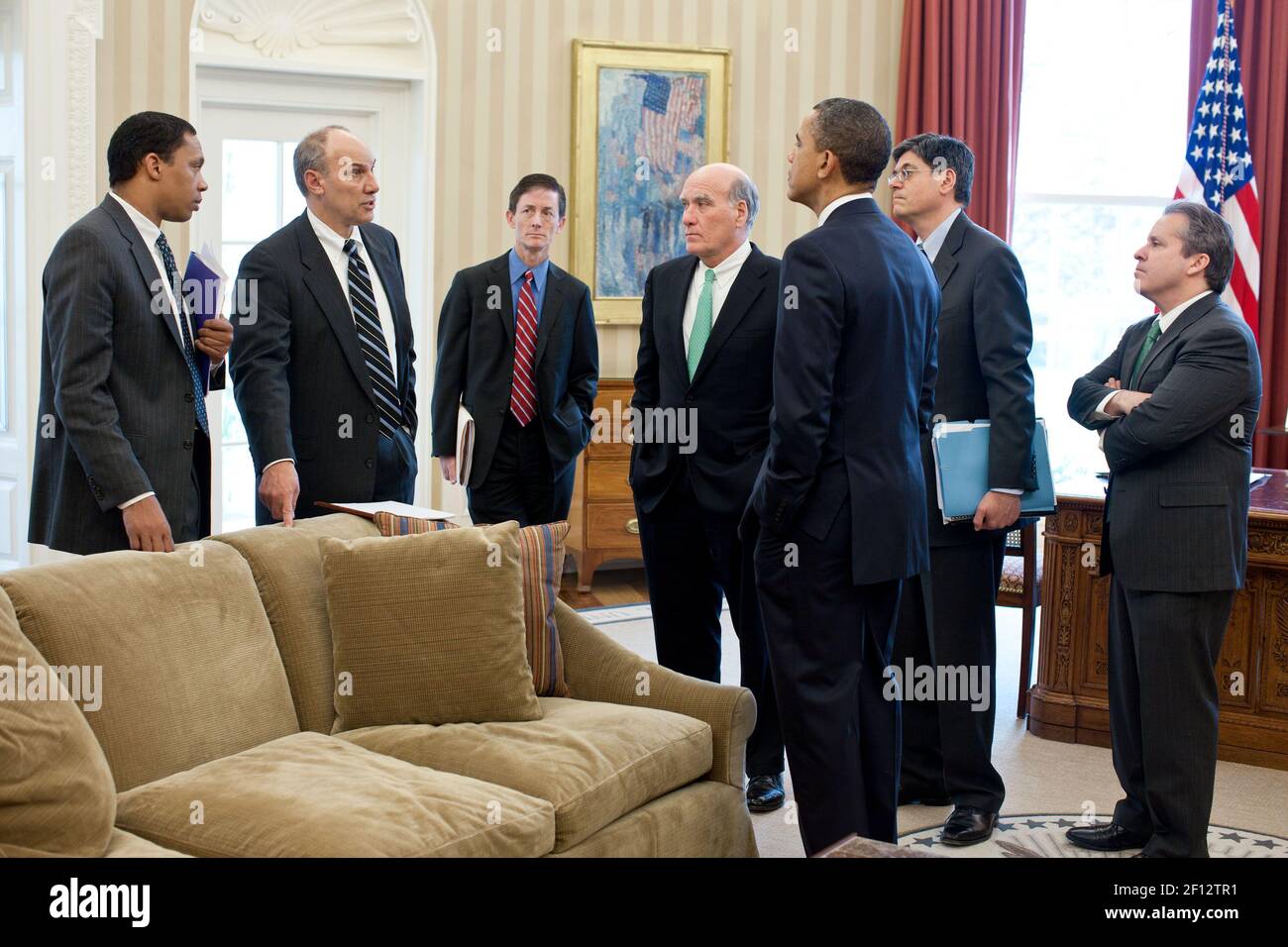 President Barack Obama talks with advisors in the Oval Office April 7 2011. Meeting with the President from left are: Rob Nabors; Phil Schiliro; Bruce Reed; Bill Daley; Jack Lew; and Gene Sperling. Stock Photo