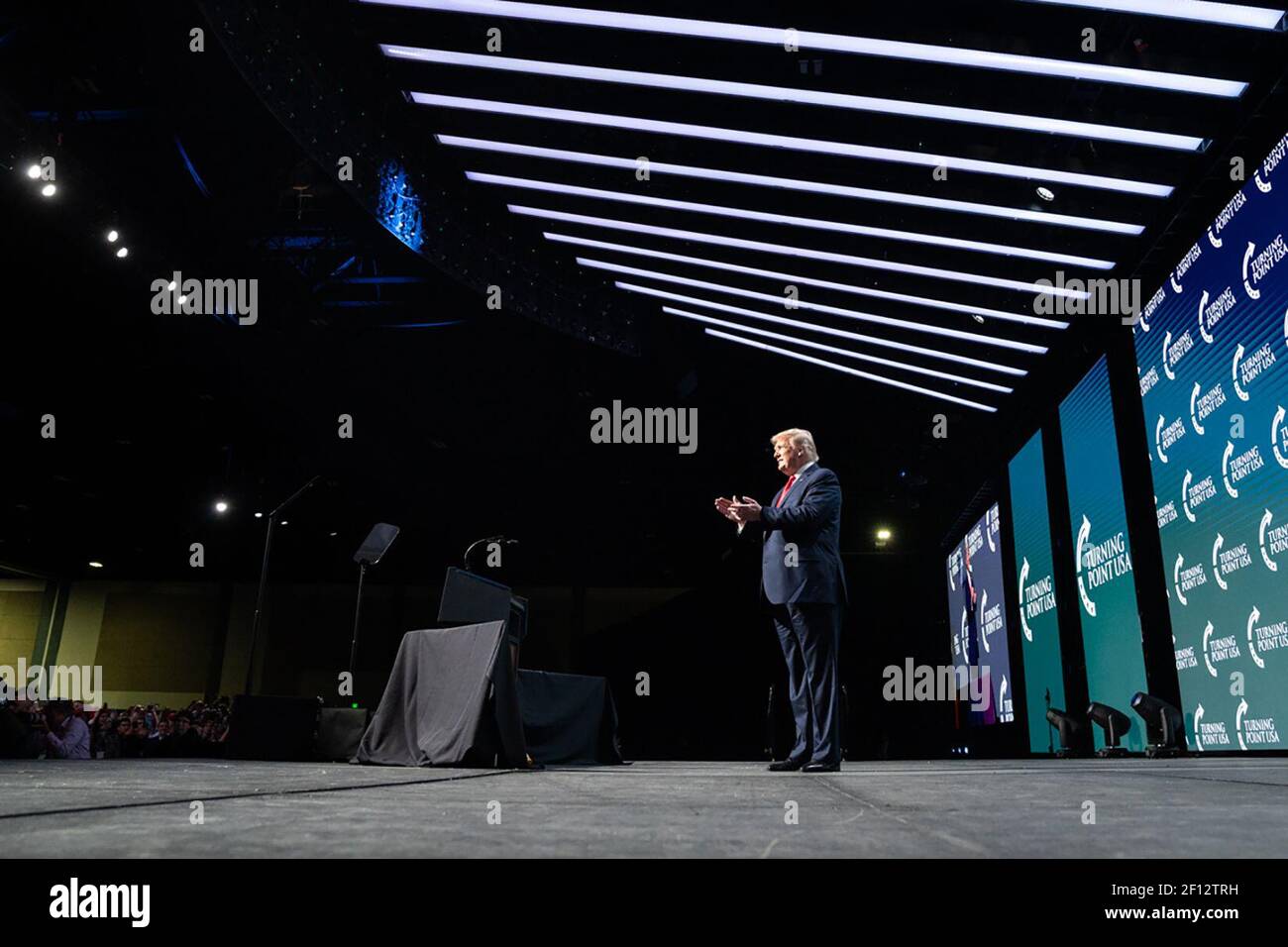 President Donald Trump acknowledges the applause from the crowd Saturday Dec. 21 2019 as he arrives on stage to address Turning Point USA's 5th annual Student Action Summit at the Palm Beach County Convention Center in West Palm Beach Fla. Stock Photo