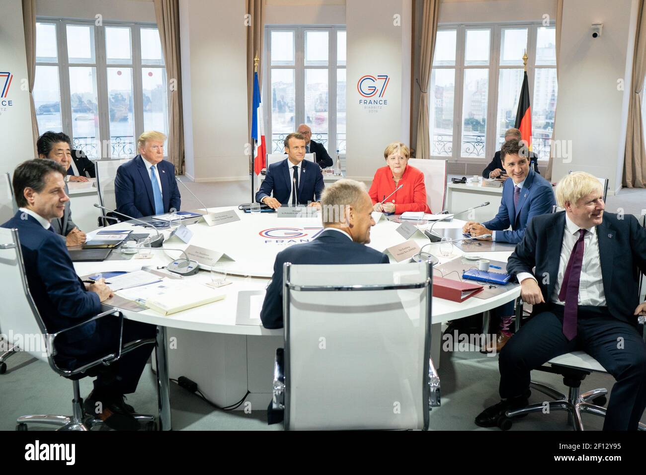 President Donald Trump joins G7 Leaders Italian Prime Minister Giuseppe Conte;  President of the European Council Donald Tusk; Japanese Prime Minister Shinzo Abe; British Prime Minister Boris Johnson; German Chancellor Angela Merkel; Canadian Prime Minister Justin Trudeau and G7 Summit host French President Emmanuel Macron during a G7 Working Session on Global Economy Foreign Policy and Security Affairs at the Centre de CongrÃ¨s Bellevue Sunday Aug. 25 2019 in Biarritz France. Stock Photo