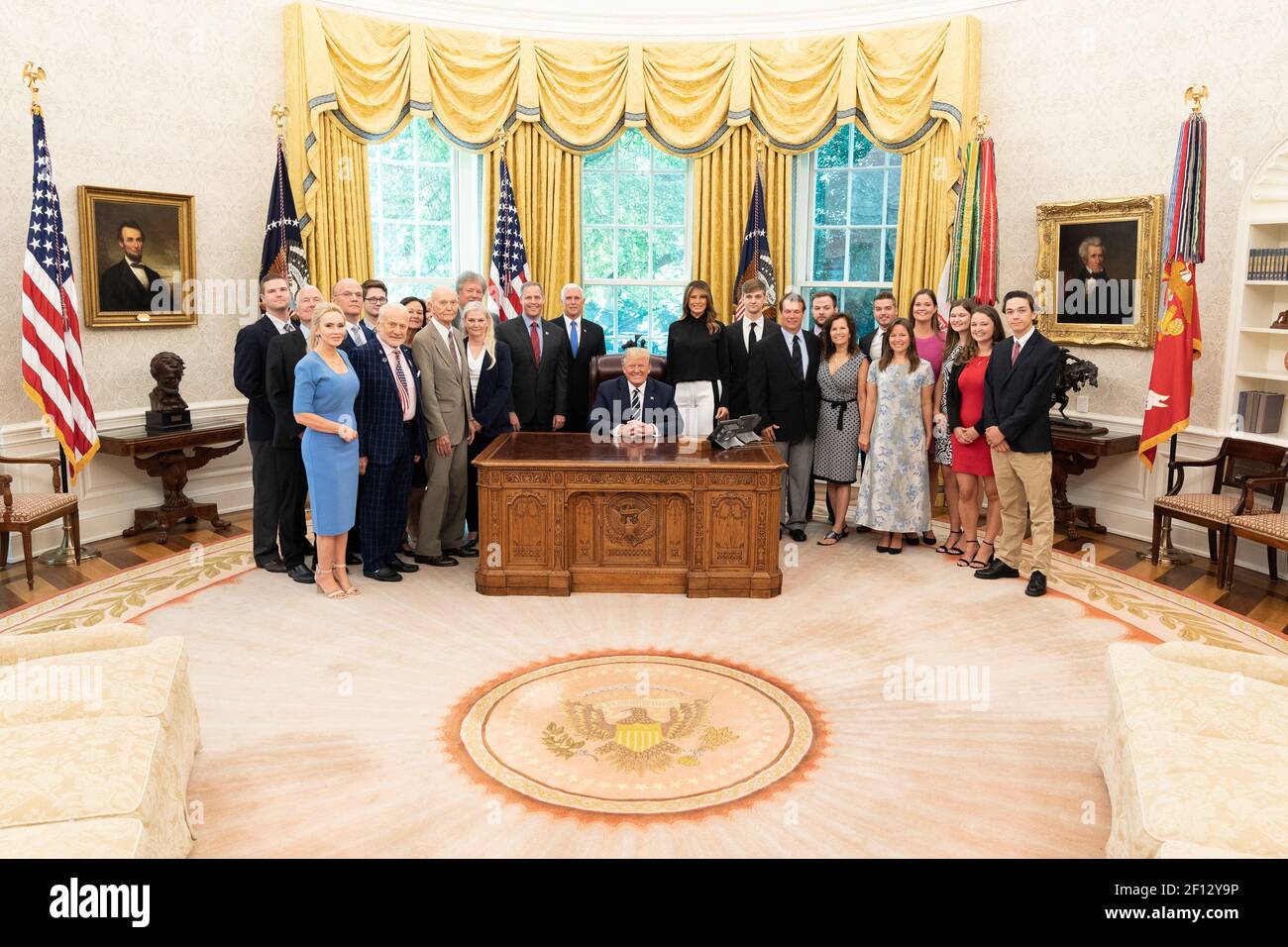 President Donald Trump and First Lady Melania Trump joined by Vice President Mike Pence and NASA Administrator Jim Bridenstine pose for a photo with Apollo 11 astronauts Buzz Aldrin and Michael Collins their family members and the family of Neil Armstrong Friday July 19 2019 during a commemorative photo opportunity for the 50th anniversary of the Apollo 11 moon landing in the Oval Office of the White House. Stock Photo