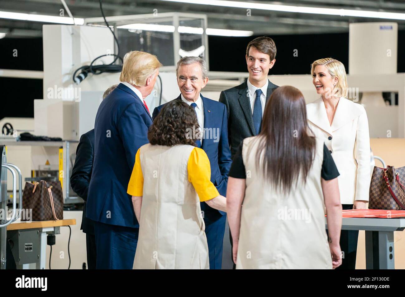 President Donald Trump visits and speaks with workers as he is joined by  Bernard Arnault CEO of LVMH Moet Hennessy; Carlos Sousa the general manager  of Louis Vuitton Manufacturing USA and Advisor