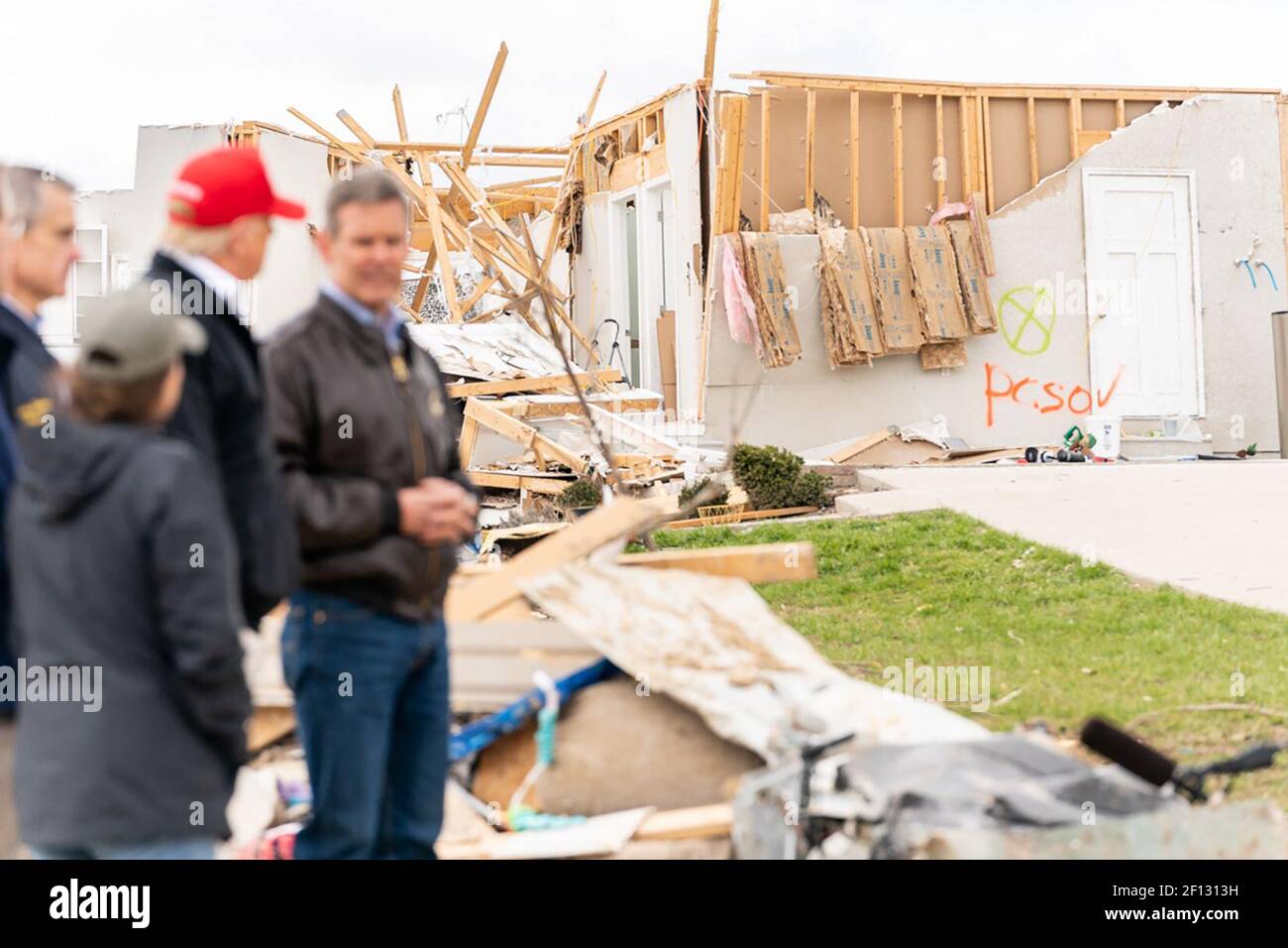 President Donald Trump joined by Tennessee Governor Bill Lee right and local officials tours a tornado ravaged neighborhood in Cookeville Tenn. Friday March 6 2020 where a tornado struck early on Tuesday March 3rd killing 18 of the 24 people killed in central Tennessee. Stock Photo