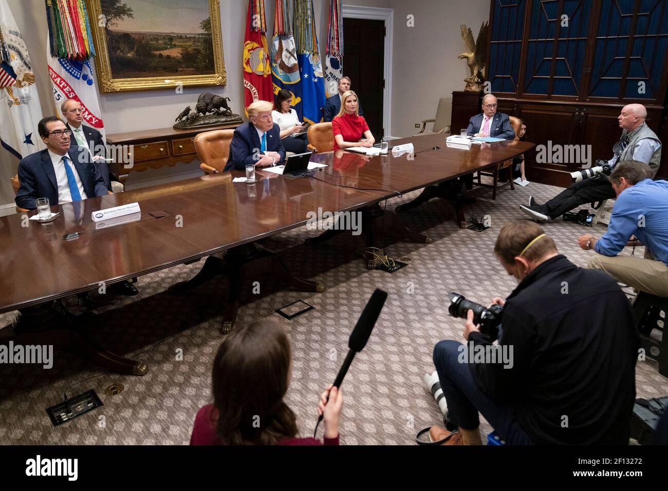President Donald Trump joined by Treasury Secretary Steven Mnuchin Advisor to the President Ivanka Trump and Director of the National Economic Council Larry Kudlow participates in a video conference with banking executives to deliver small business relief Tuesday April 7 2020 in the Roosevelt Room of the White House. Stock Photo