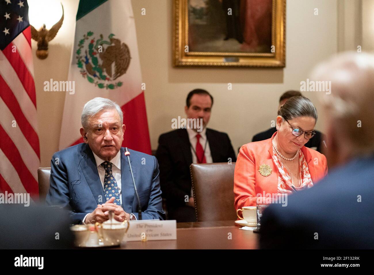 President Donald Trump listens as Mexican President Andres Manuel Lopez Obrador addresses his remarks during an expanded bilateral meeting Wednesday July 8 2020 in the Cabinet Room of the White House. Stock Photo
