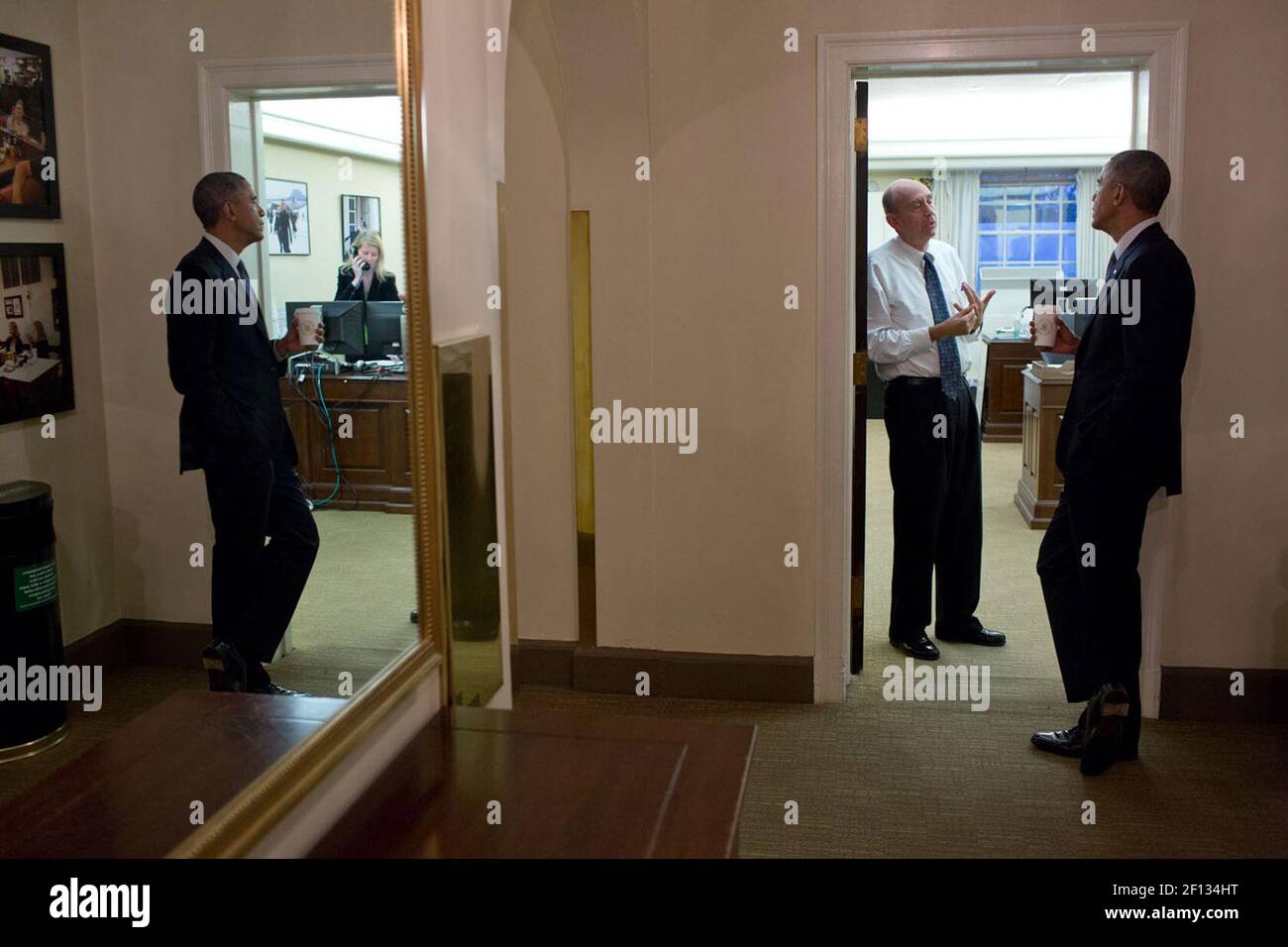 Nov. 19, 2014 - President ventured upstairs to the second floor of the West Wing to talk with Neil Eggleston, Counsel to the President, outside his office. Stock Photo