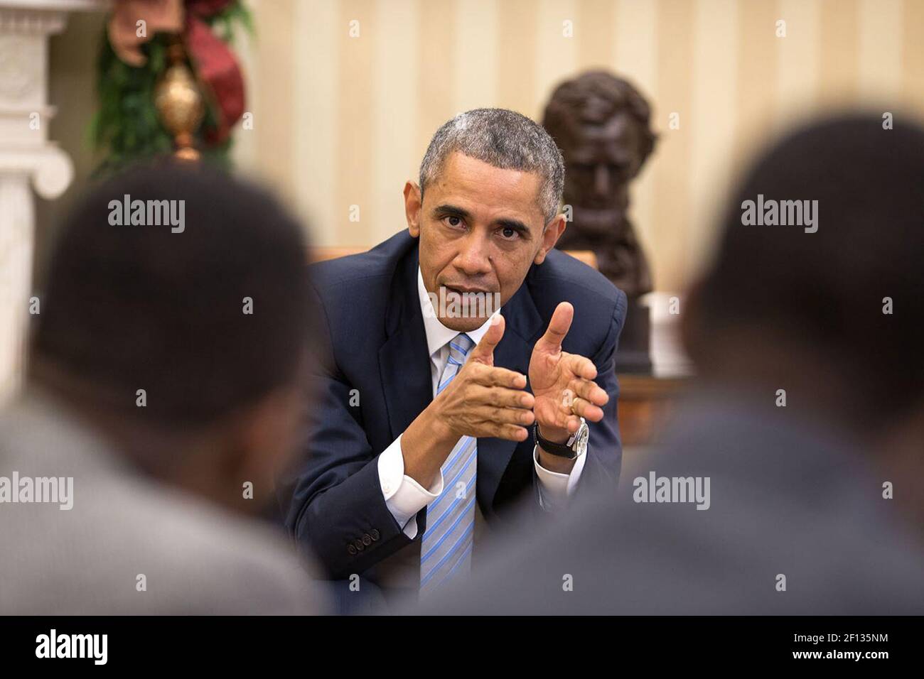 President Barack Obama meets with young local and national civil rights leaders in the Oval Office, Dec. 1, 2014. Stock Photo