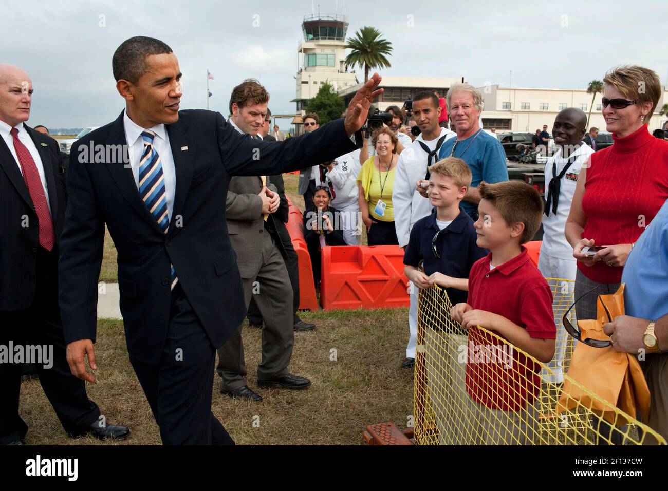 President Barack Obama waves to a family prior to departure from Naval Air Station Jacksonsville in Jacksonville Fla. en route to Miami Fla. Oct. 26 2009. Stock Photo