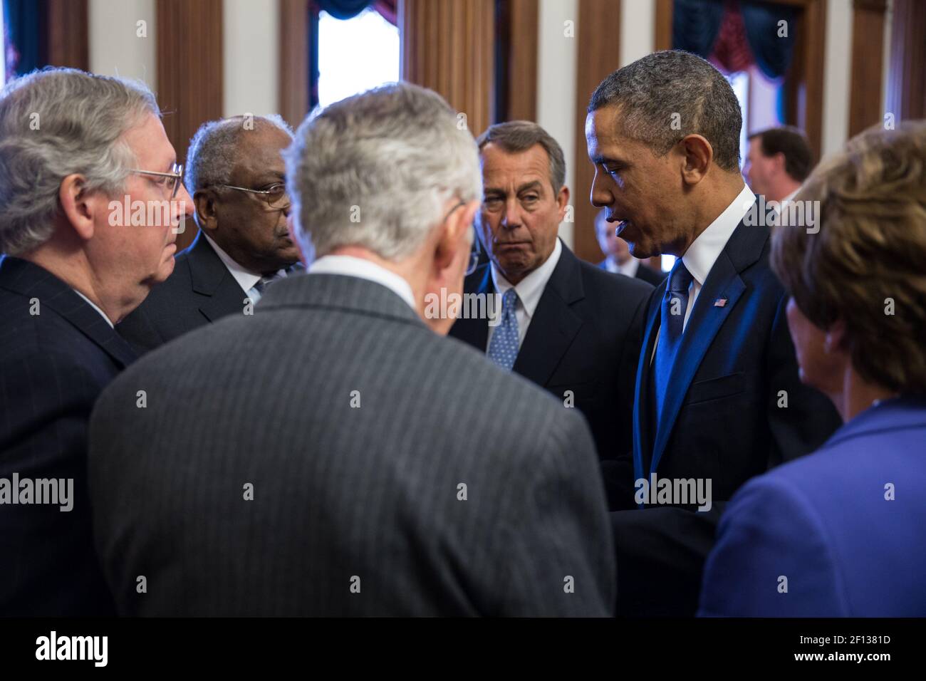 President Barack Obama talks with Congressional leaders prior to the Rosa Parks statue unveiling ceremony at the U.S. Capitol in Washington D.C. Feb. 27 2013. Pictured from left are: Minority Leader Sen. Mitch McConnell R-Ky.; Rep. James Clyburn D-S.C.; Majority Leader Sen. Harry Reid D-Nev.; House Speaker John Boehner R-Ohio; and House Minority Leader Rep. Nancy Pelosi D-Calif. Stock Photo