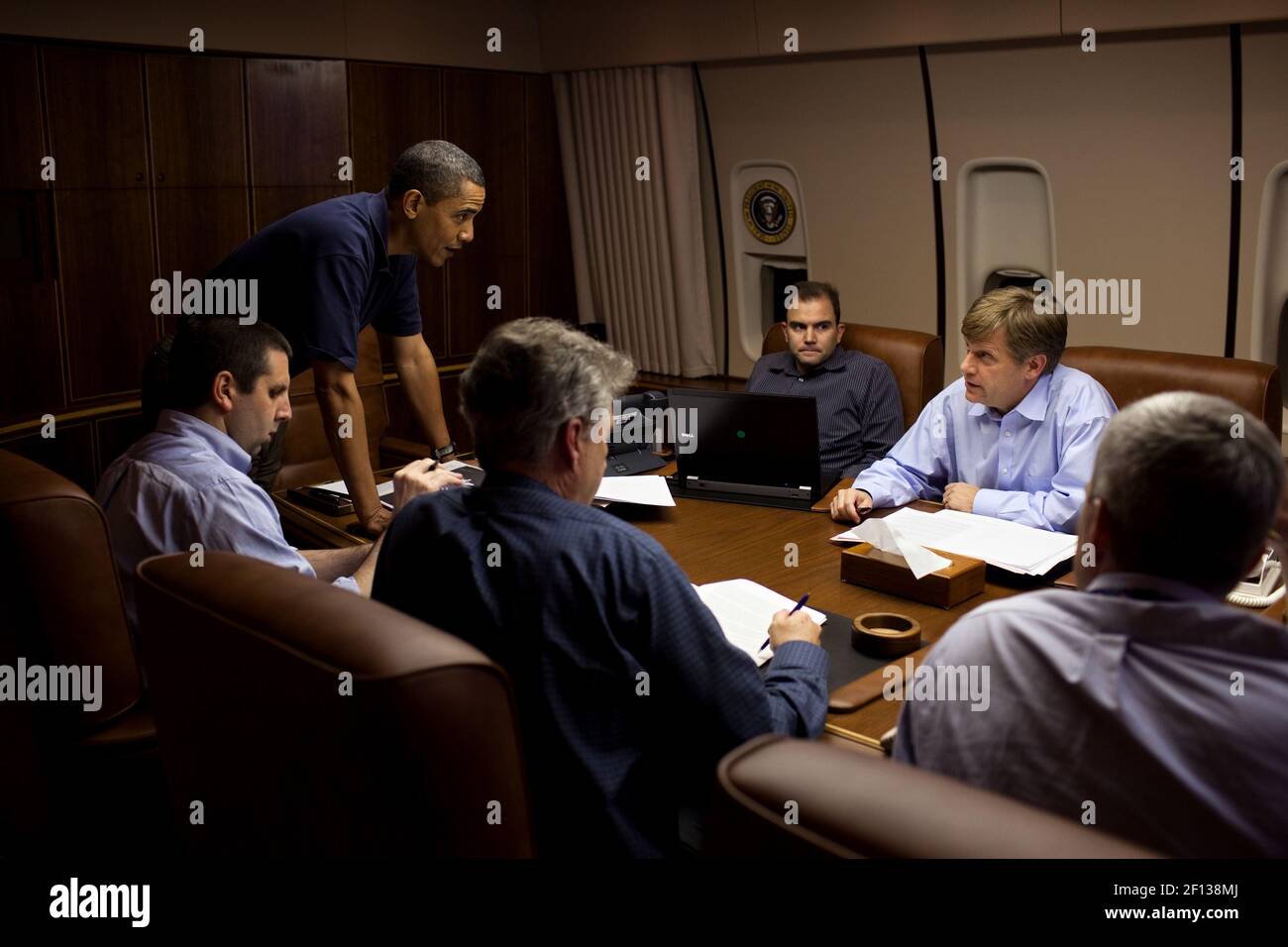 President Barack Obama is briefed by from left NSC Chief of Staff Mark Lippert Former U.S. Ambassador to Russia William J. Burns Deputy National Security Advisor for Strategic Communications Ben Rhodes NSC Senior Director for Russian Affairs Mike McFaul and Deputy National Security Advisor for Strategic Communications Denis McDonough in the Conference Room aboard Air Force One during a flight to Moscow Russia July 5 2009. Stock Photo