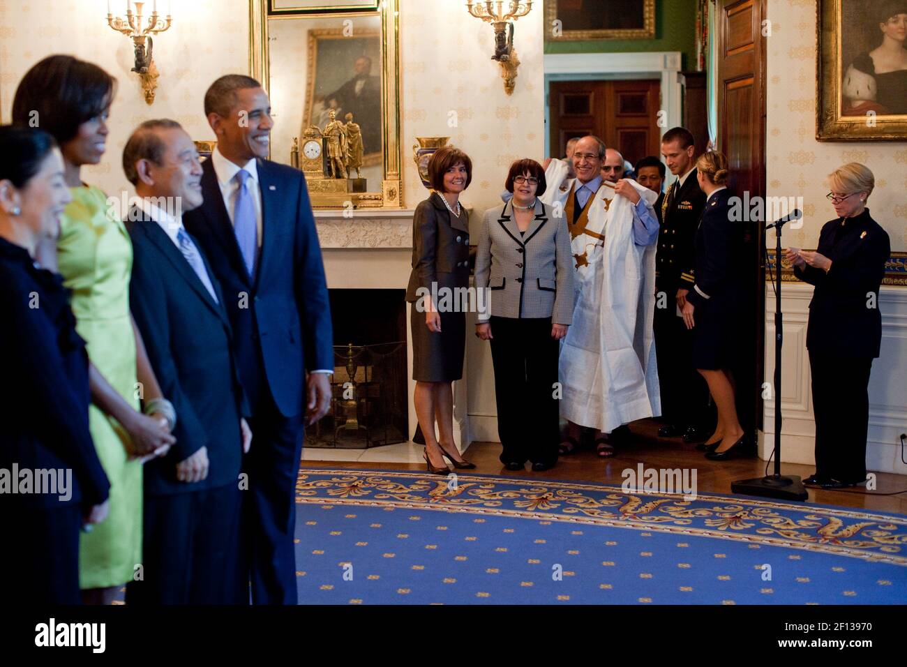 President Barack Obama and First Lady Michelle Obama greet ambassadors and guests during a Diplomatic Corps Reception receiving line in the Blue Room of the White House Oct. 5 2010. Stock Photo