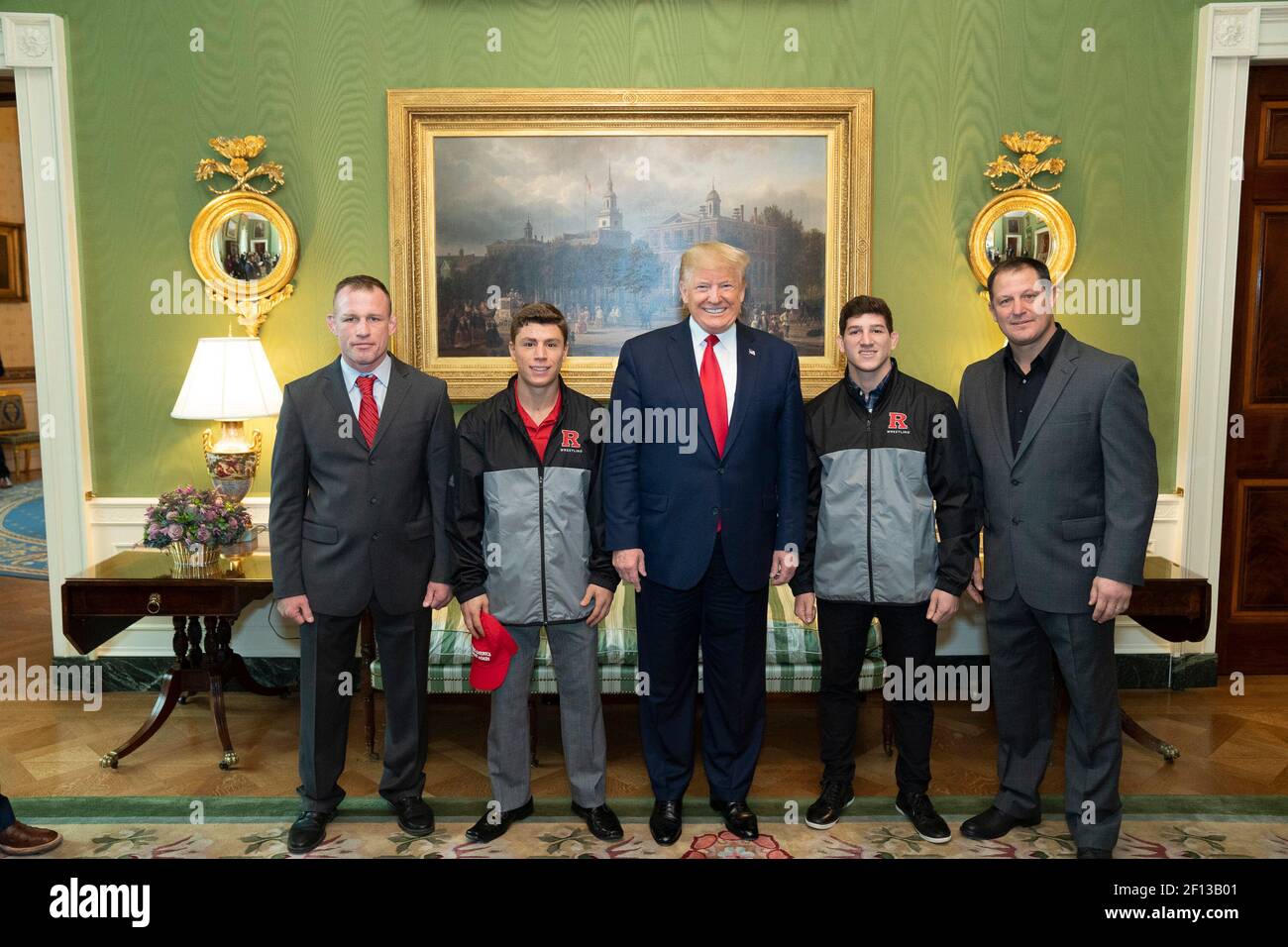 President Donald Trump poses with members of the 2019 NCAA Rutgers University Men's Champion Wrestling team Friday Nov. 22 2019 during the NCAA Collegiate National Champions Day in the Green Room of the White House. Stock Photo