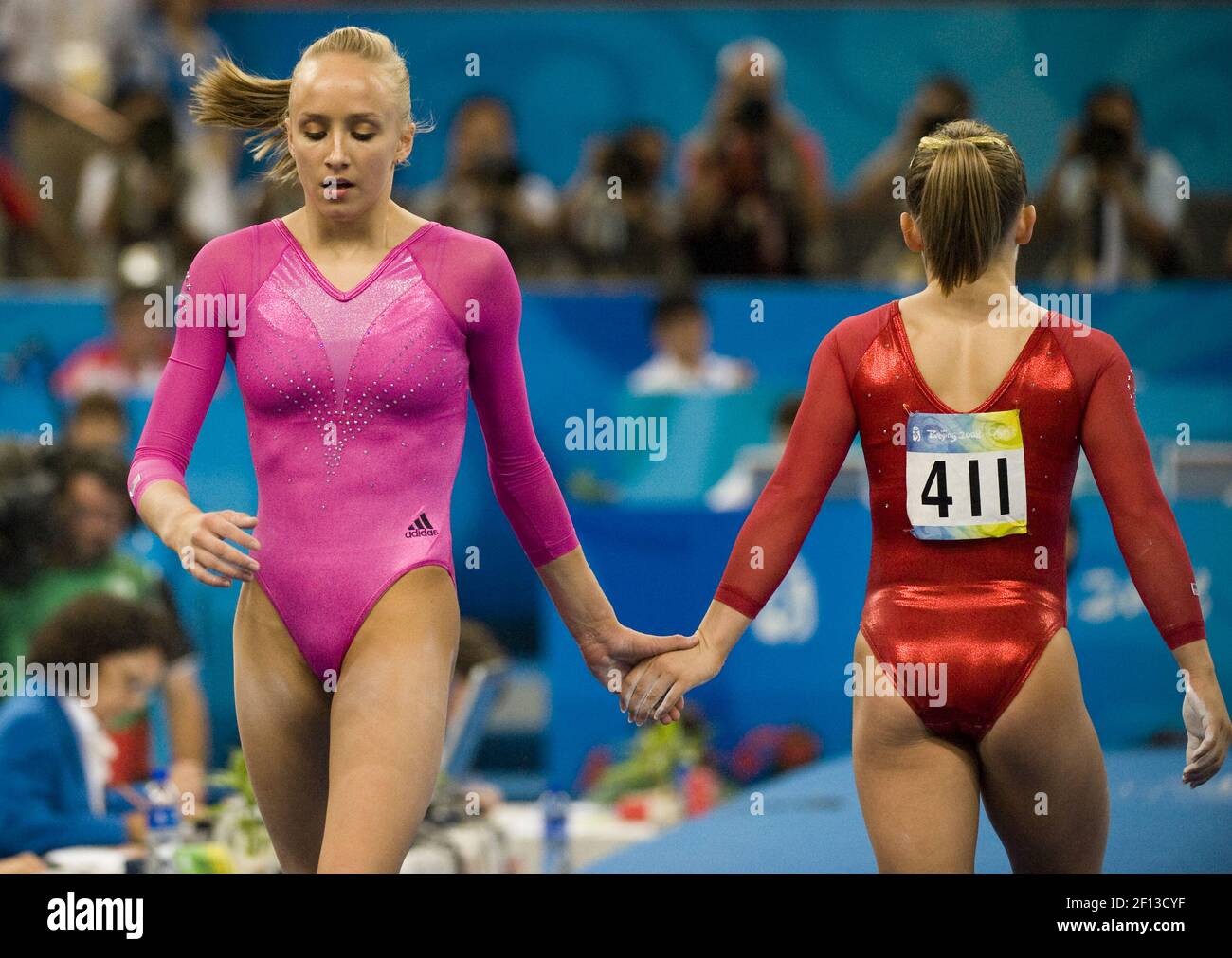 Nastia Liukin of the United States clasps hands with fellow American Shawn Johnson after competing on the floor exercise on her way to winning gold during the Women's Individual All-Around Friday, August 15, 2008 in the Games of the the XXIX Olympiad in Beijing, China. Johnson won silver. (Photo by Paul Kitagaki/Sacramento Bee/MCT/Sipa USA) Stock Photo