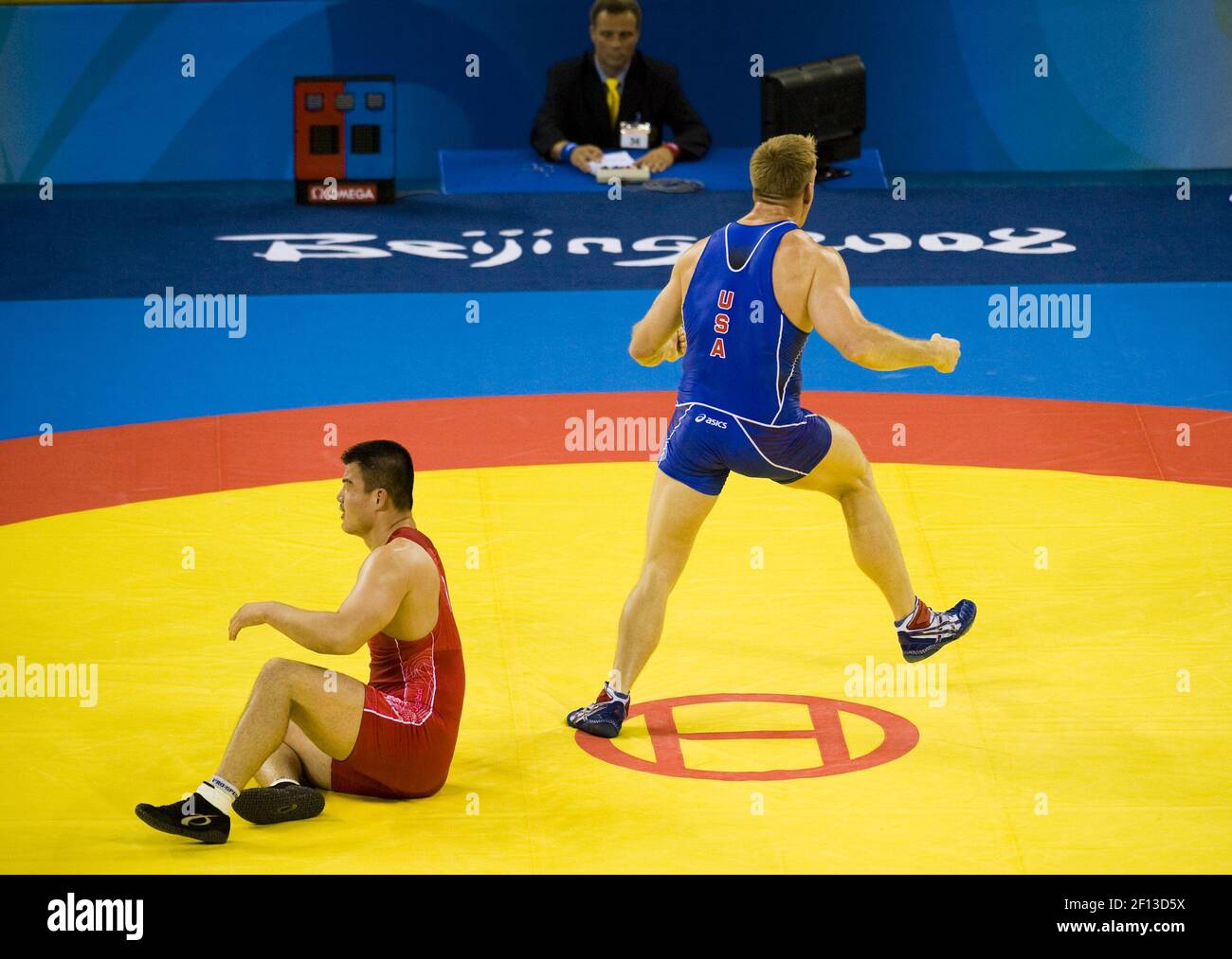Adam Wheeler of the United States, in blue, defeats Tae-Young Han of ...