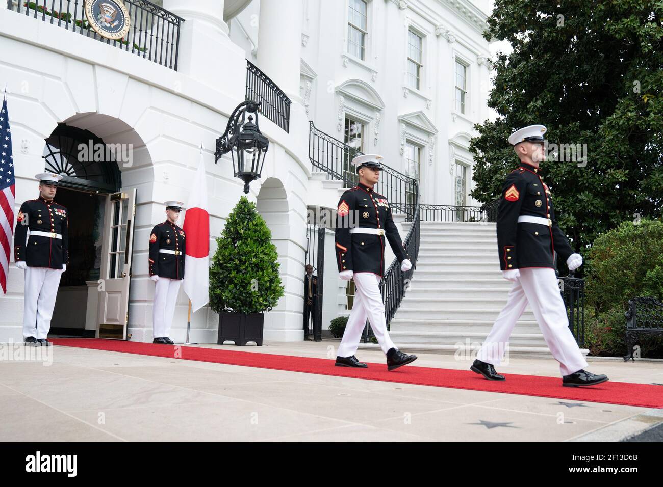 A U.S. Marine honor guard walks from the South Portico entrance of the White House Friday evening April 26 2019 in preparation for the arrival of Japanese Prime Minister Shinzo Abe and his wife Akie Abe to attend a private dinner with President Donald Trump and First Lady Melania Trump. Stock Photo