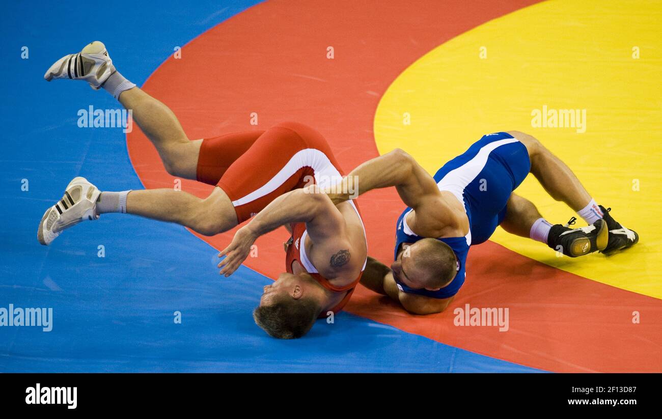 Aslanbek Khustov of Russia, in blue, beats Mirko Englich of Germany for gold in the 96kg Greco-Roman wrestling division in the Games of the XXIX Olympiad in Beijing, China. (Photo by Paul Kitagaki Jr./Sacramento Bee/MCT/Sipa USA) Stock Photo