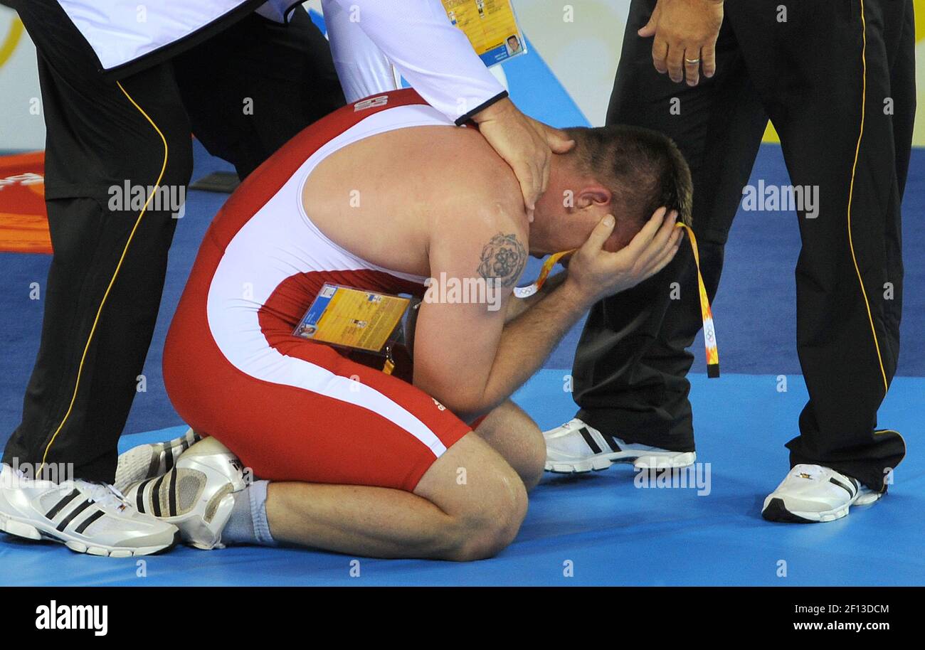 Mirko Englich of Germany celebrates after defeating Adam Wheeler of the United States in Greco Roman wrestling on Thursday, August 14, 2008, in the Games of the XXIX Olympiad in Beijing, China. (Photo by Jeff Siner/Charlotte Observer/MCT/Sipa USA) Stock Photo
