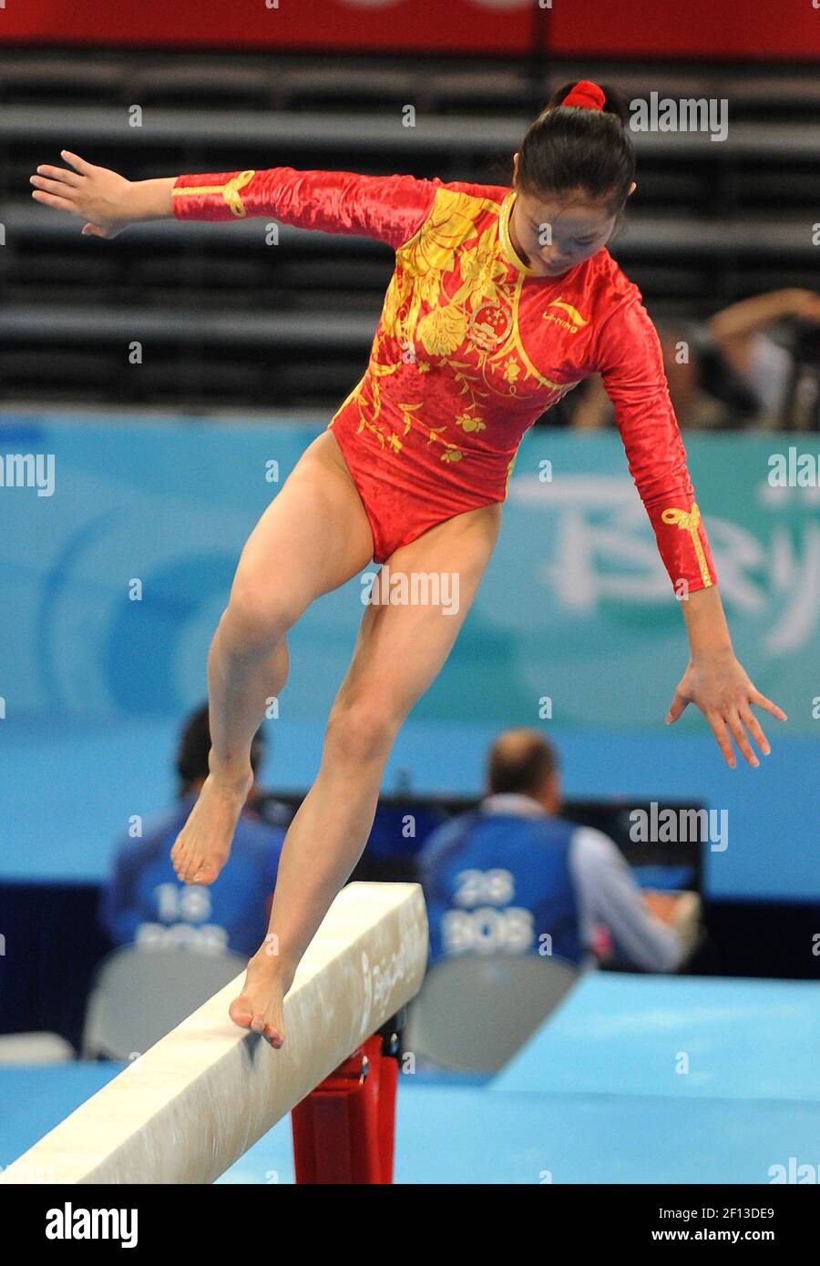 Fei Cheng of China loses her balance on the beam during the women's ...