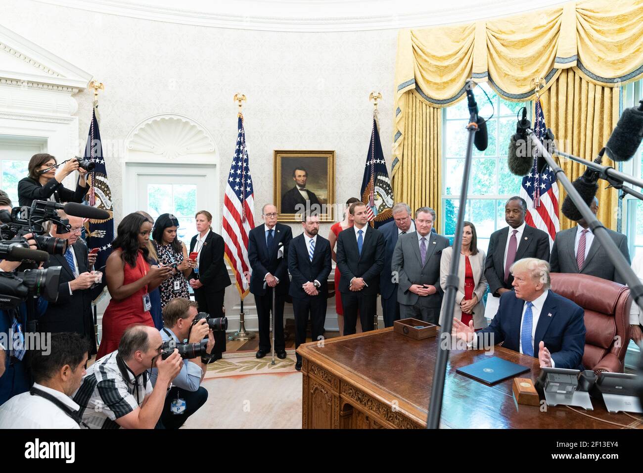 President Donald Trump speaks with reporters after signing an executive order on establishing a White House Council on Eliminating Regulatory Barriers to Affordable Housing Tuesday June 25 2019 in the Oval Office of the White House. Stock Photo