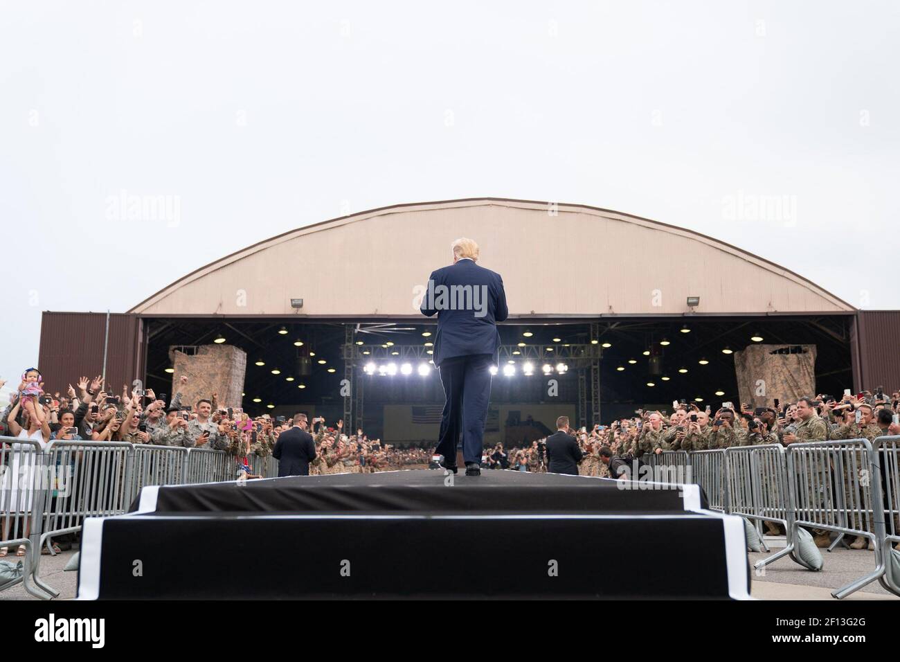 President Donald Trump arrives to address military personnel and their