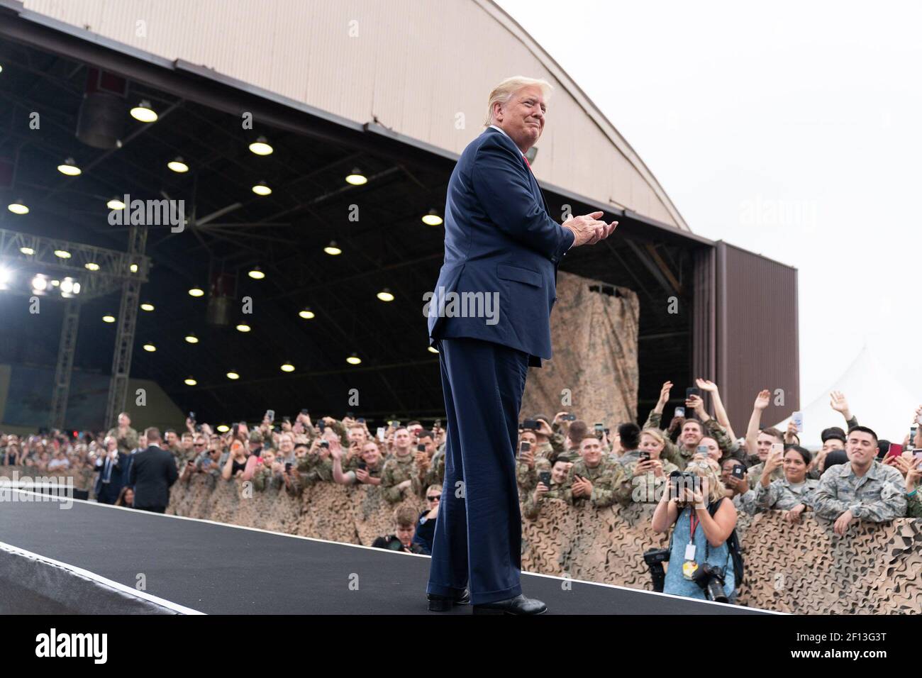President Donald Trump arrives to address military personnel and their