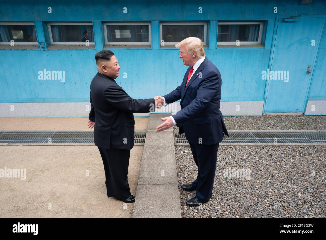 President Donald Trump shakes hands with Chairman of the Workers' Party of Korea Kim Jong Un Sunday June 30 2019 as the two leaders meet at the Korean Demilitarized Zone. Stock Photo