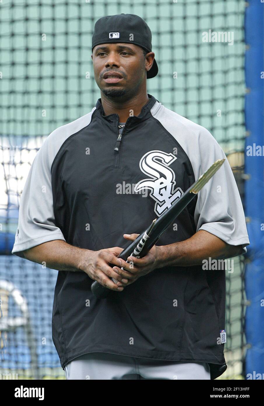 Chicago White Sox player Ken Griffey Jr. walks off the field with a broken  bat at the end of batting practice before a MLB game between the Kansas  City Royals and Chicago