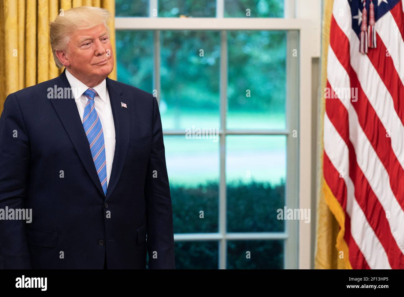 President Donald Trump watches as new Secretary of Defense Mark Esper delivers remarks Tuesday July 23 2019 in the Oval Office of the White House. Stock Photo