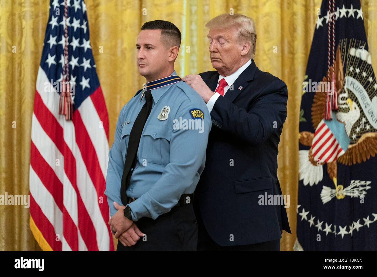 President Donald Trump presents the Medal of Valor to Officer Jeremy Campbell during the Medal of Valor and Heroic Commendations Ceremony Monday Sep. 9 2019 in the East Room of the White House. Stock Photo