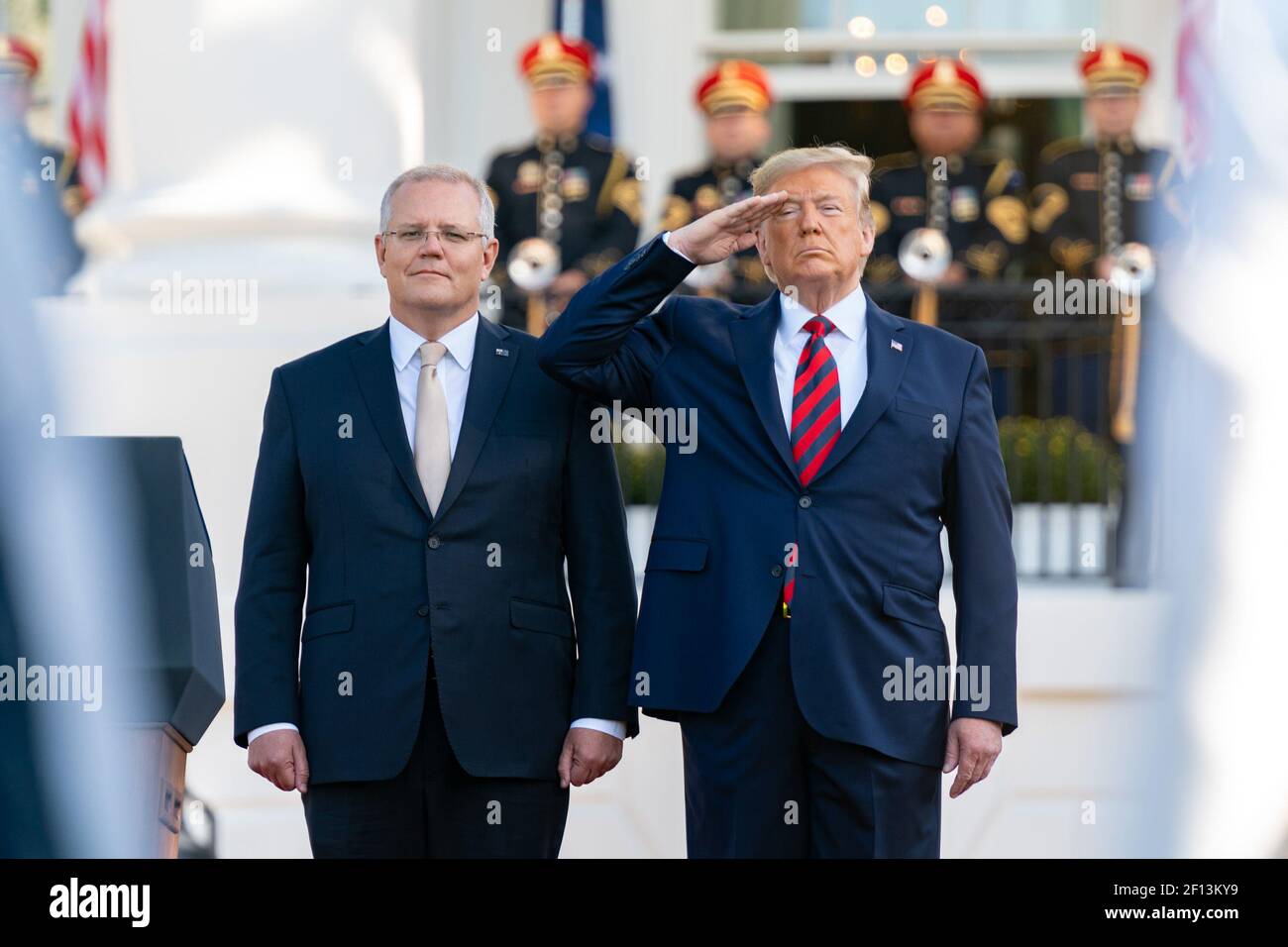 President Donald Trump salutes as he and Australian Prime Minister Scott Morrison review an honor guard parade at the State Visit arrival Friday Sept. 20 2019 on the South Lawn of the White House. Stock Photo