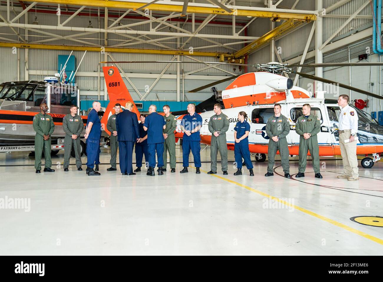 President Donald Trump meets with U.S. Coast Guard personnel during his briefing on Tropical Storm Imelda Sunday Sept. 22 2019 at the U.S. Coast Guard Hangar in Houston Texas. Stock Photo
