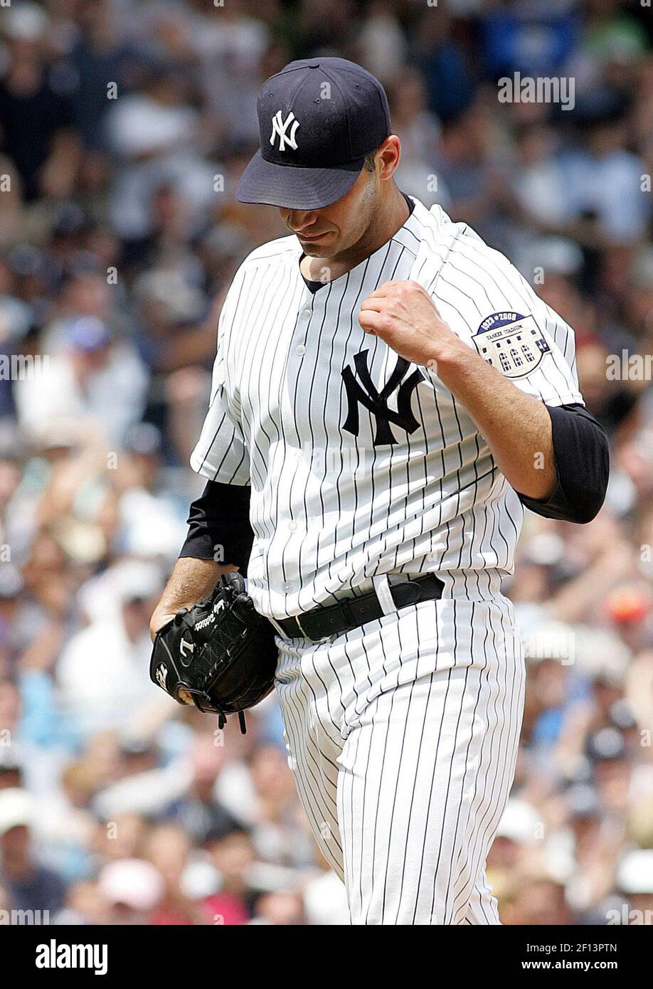 New York Yankees starting pitcher Andy Pettitte pumps his fist after getting out of a bases