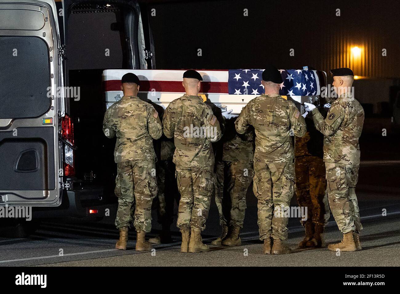 U.S. Army military honor guard members are seen during the dignified transfer ceremony Thursday evening Nov. 21 2019 at Dover Air Force Base in Dover Del. for Chief Warrant Officer 2 David C. Knadle of Tarrant Texas and Chief Warrant Officer 2 Kirk T. Fuchigami Jr. of Keaau Hawaii who were killed Wednesday in a helicopter crash in Afghanistan. Stock Photo