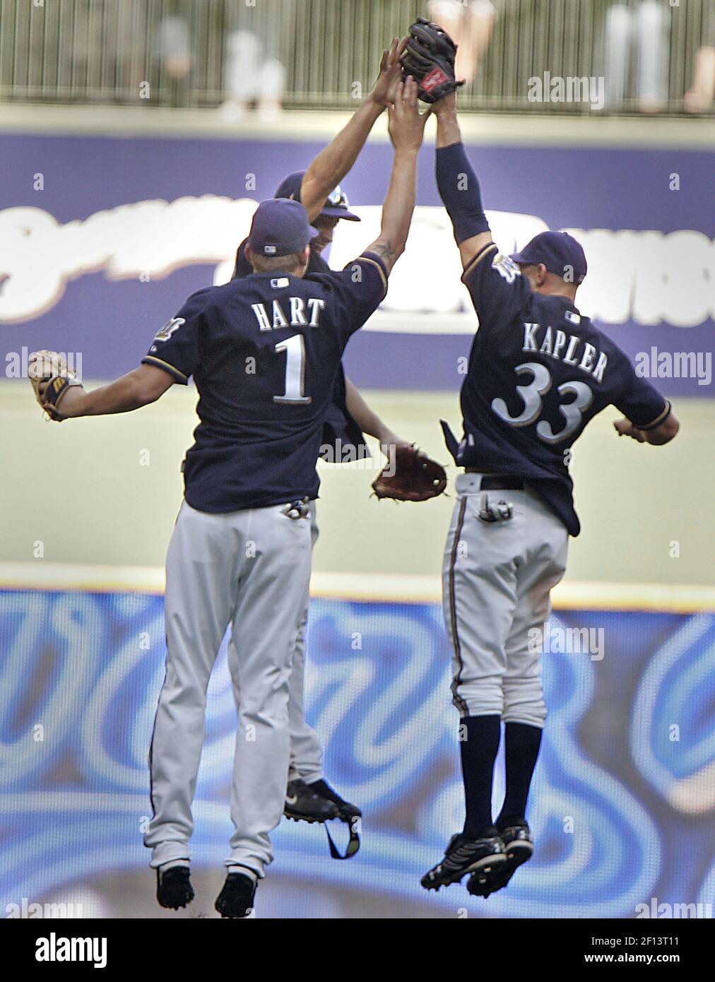 Milwaukee Brewers' Ryan Braun (8), Gabe Kapler (33) and Mike Cameron,  center, celebrate after the ninth inning of a baseball game against the  Pittsburgh Pirates on Sunday, July 6, 2008, in Milwaukee.