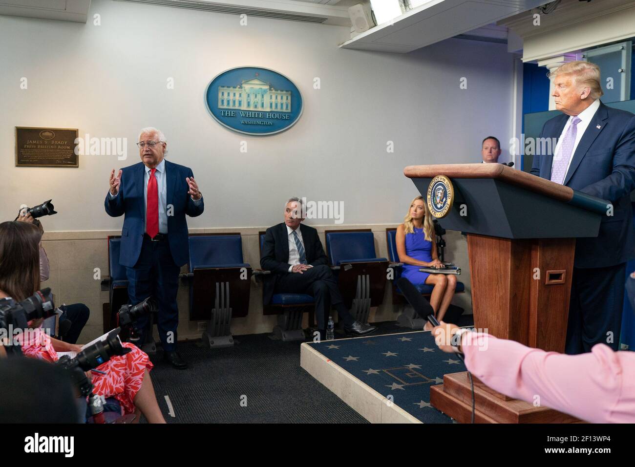 President Donald Trump listens as United States Ambassador to Israel David Friedman answers questions from members of the press Thursday Aug. 13 2020 during a press conference in the James S. Brady Press Briefing Room of the White House. Stock Photo