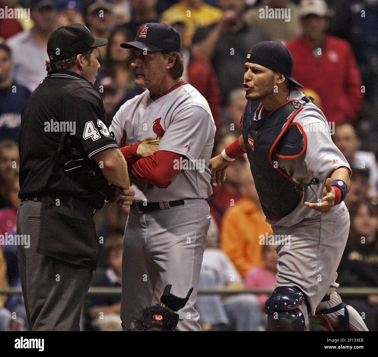 St. Louis Cardinals' manager Tony LaRussa separates catcher Yadier