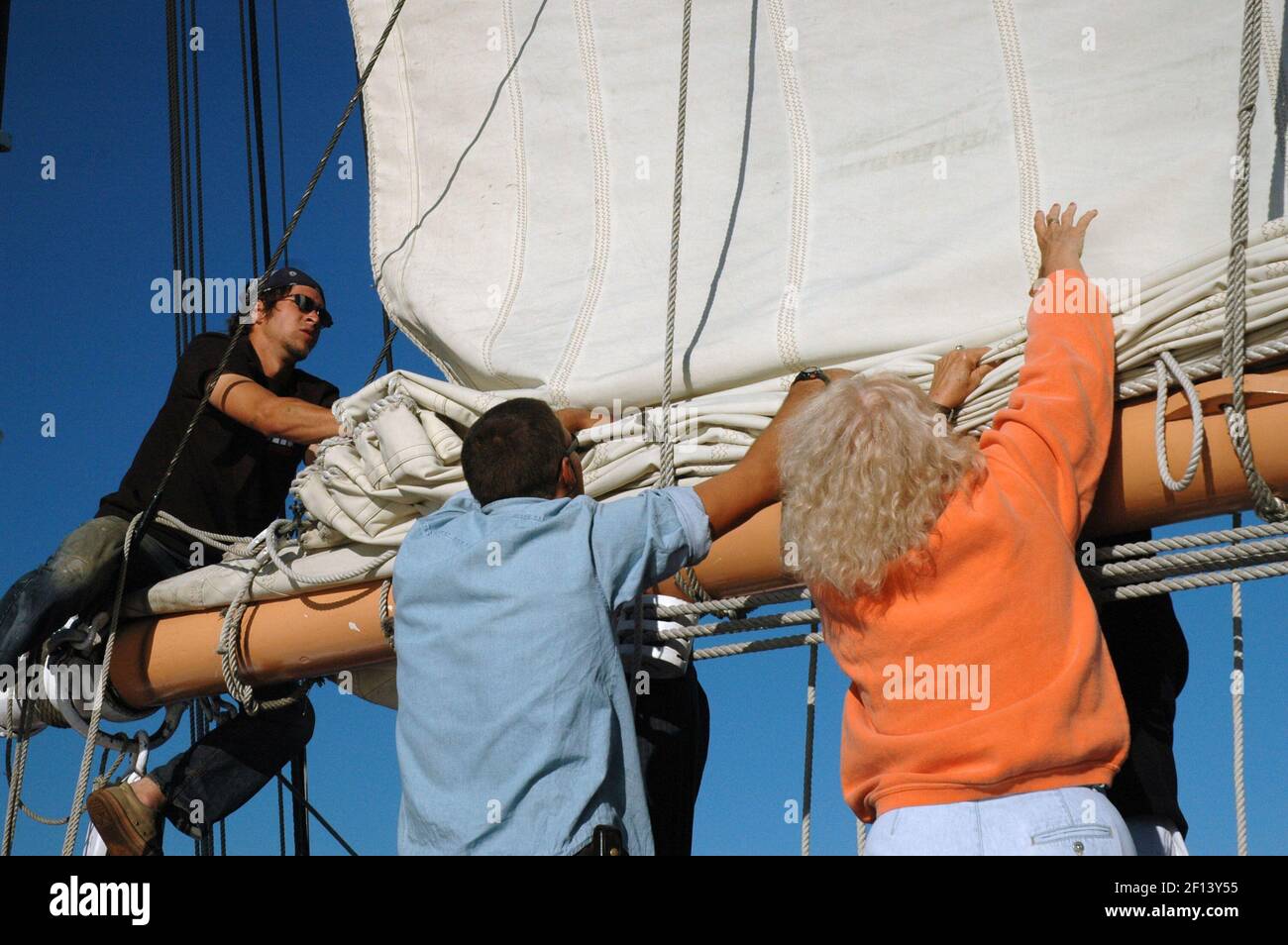Lowering the sail aboard the Victory Chimes, one of Maine's classic